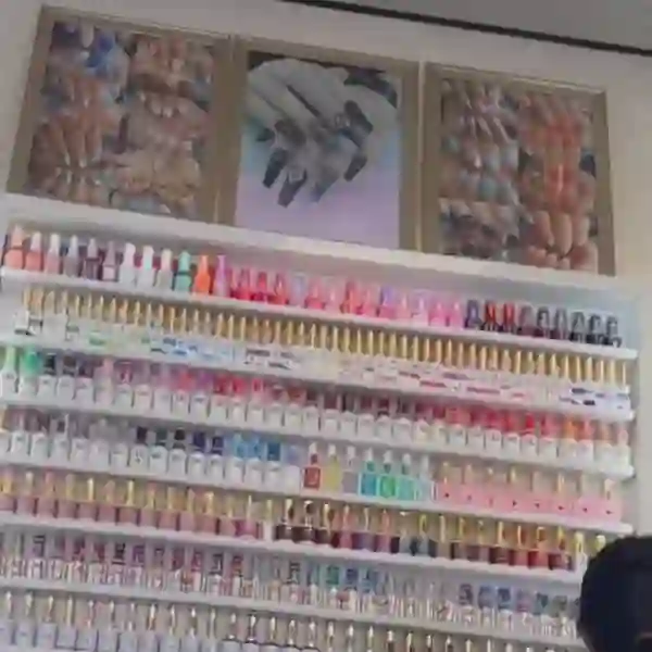 Wall of hundreds of gel colours inside Priya's salon in Ashton-under-Lyne