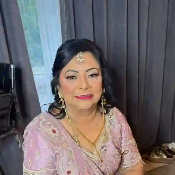Bridal hair and makeup in pink lengha styled by Priya